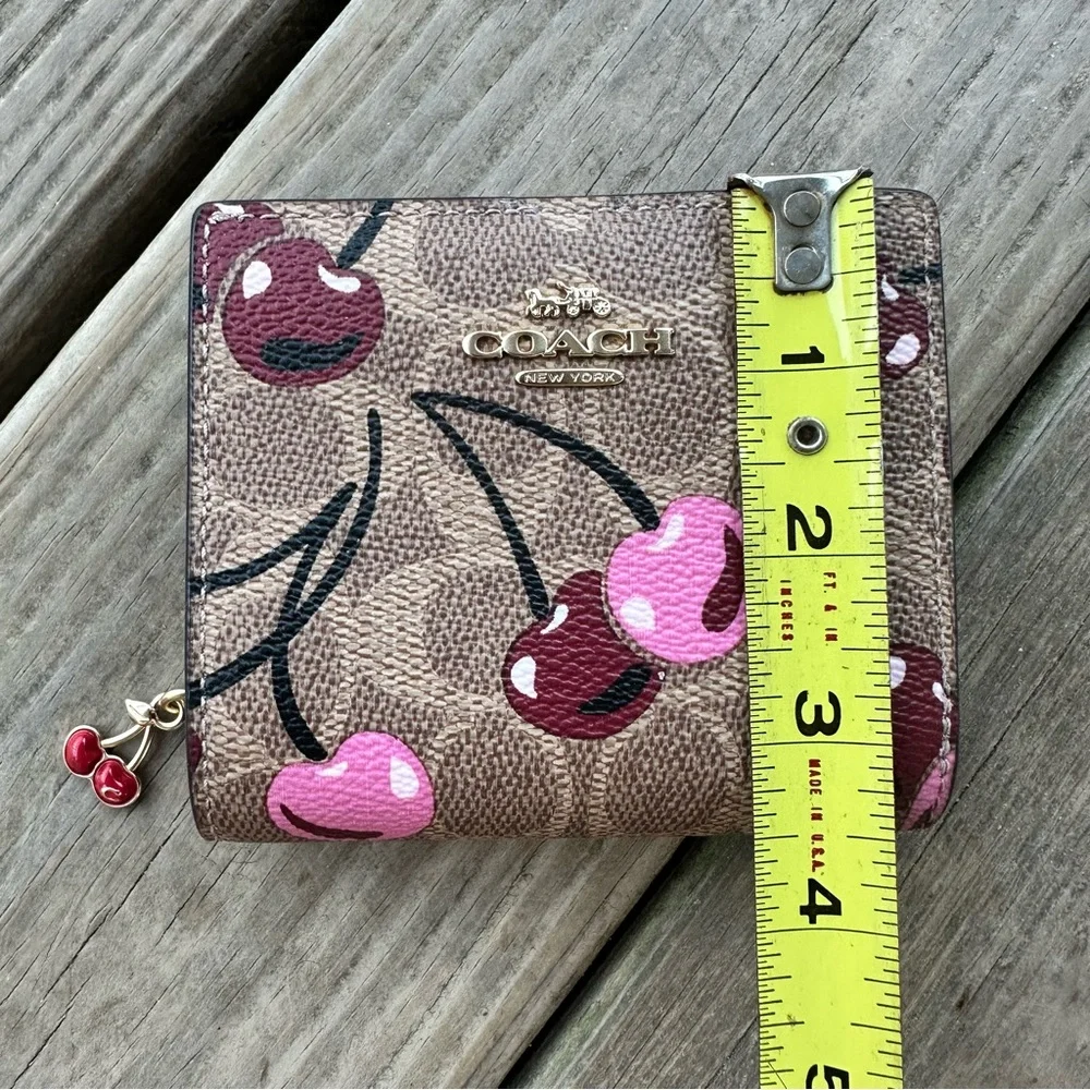 Coach Snap Wallet In Signature Canvas With Cherry Print In Tan Multi Zip Fold